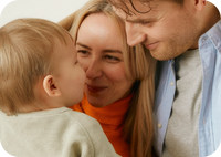 mom and dad looking at child in a loving way