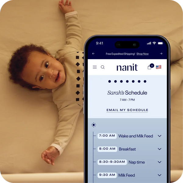 child in background laying in crib with nanit sleep schedule generator displaying on mobile